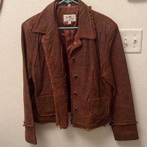 XL brown leather coat with fringe. Excellent condition.